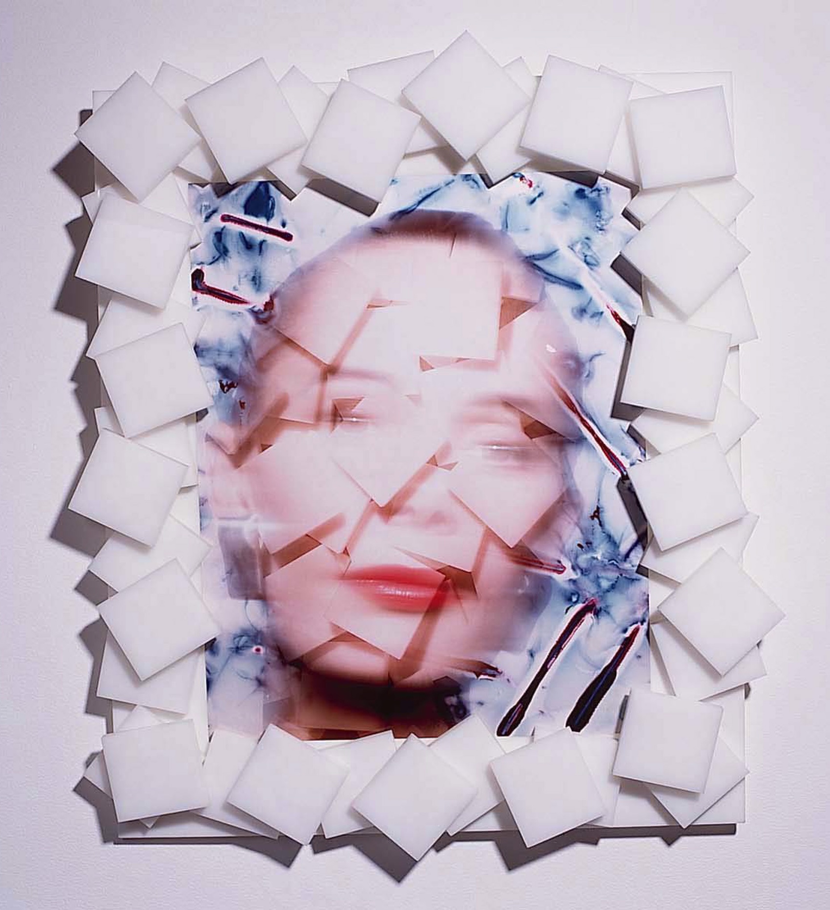 an image of a face that has been illustrated with a layering of squares that subtly create an abstracted face.