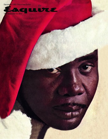 Photographic image of Sonny Liston, a black man, wearing a Santa Claus hat.