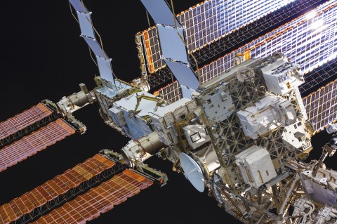 View of a portion of the international space station and solar panels.