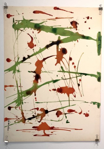 Abstract blotchy color drawing of ink on paper. Green and red