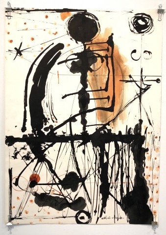 Abstract blotchy color drawing of ink on paper. Black, orange highlights