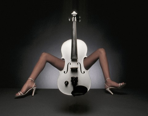 Manipulated photographic image of a woman's legs straddling a cello 