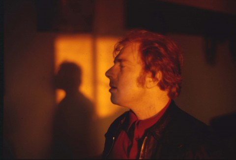 Color photo portrait of musician Van Morrison. A close up and blurred image of his profile sunlight. 