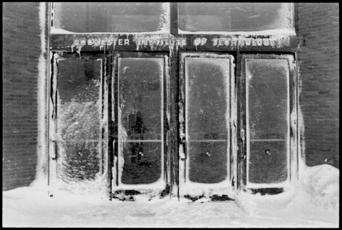 Image offer glass entry doors covered with snow