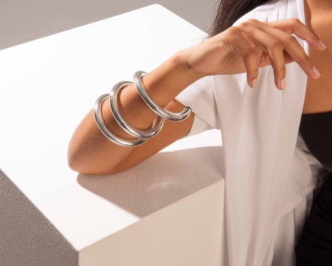 Person's arm with silver wrap bracelet
