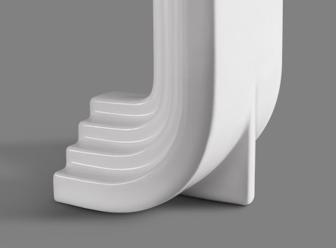 Close up of white porcelain swoop shaped bookend