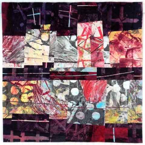 a painterly fabric quilt with a center horizon of blocks resembling a city scape with a dark purple sky and foreground.