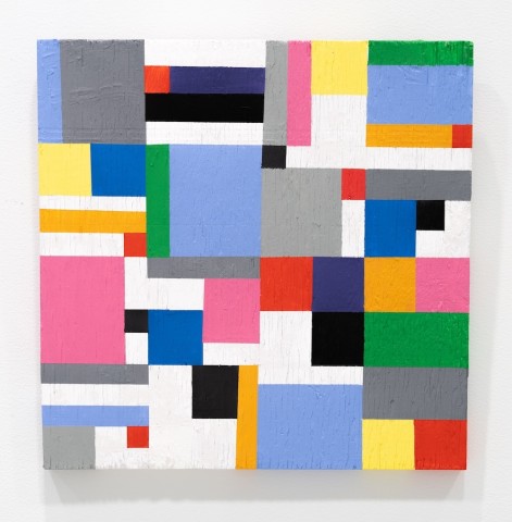 a square panel with blocks of color based on a grid design.