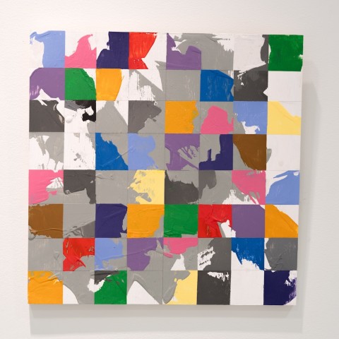a square panel with blocks of color based on a grid design.