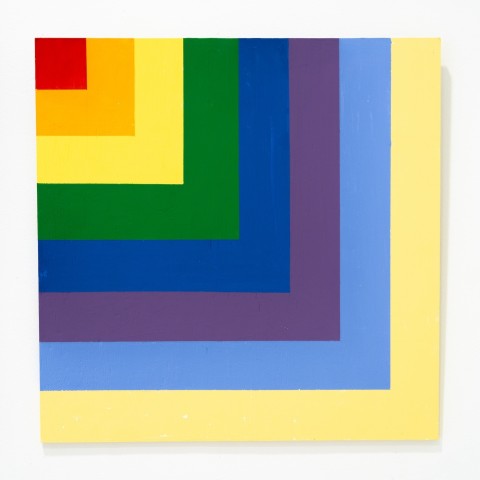 a square panel with blocks of color based on a grid design.