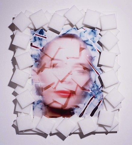 an image of a face that has been illustrated with a layering of squares that subtly create an abstracted face.