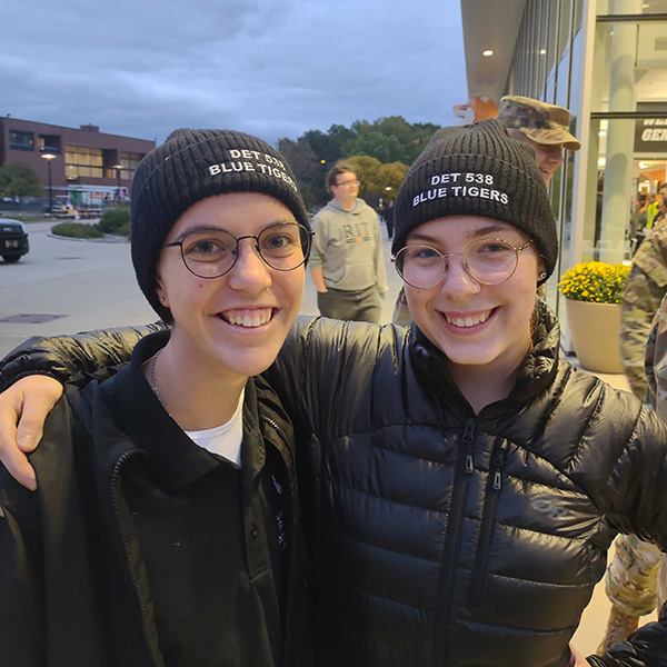 Cadet Sofia DeFelice posing with another cadet.