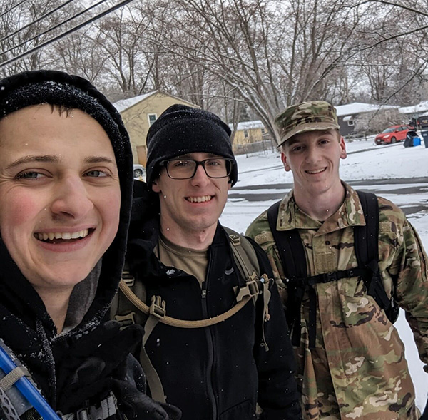 Cadet Logan Fasser and 2 other cadets outside in the winter.