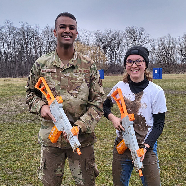 Cadet Tess Libby holding a training firearm