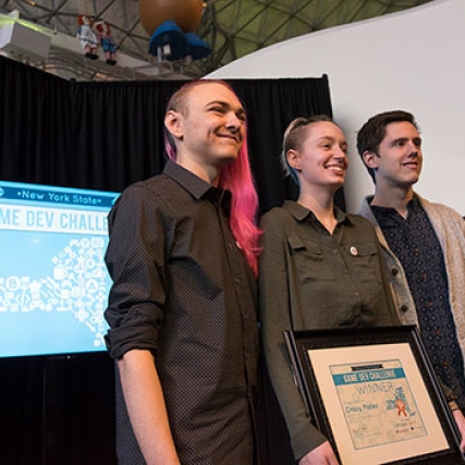 The RIT student team poses for a photo with their Game Dev Challenge first place certificate.