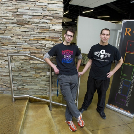 People posing outside classroom