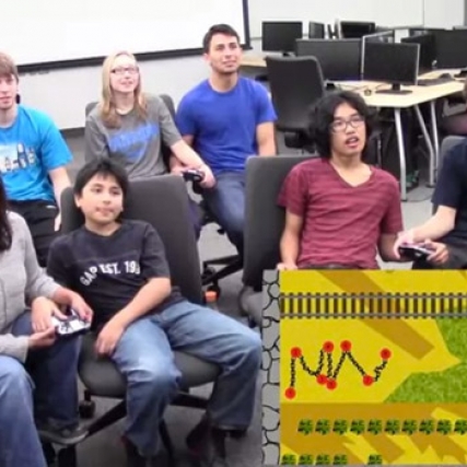 People in classroom playing game