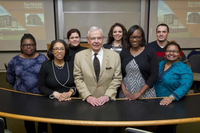 People posing at event