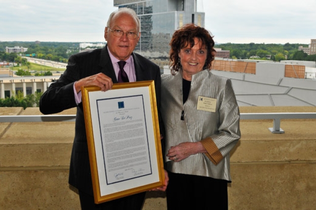 People posing with award