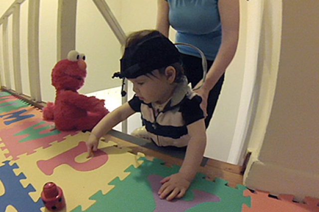 Child playing on a mat