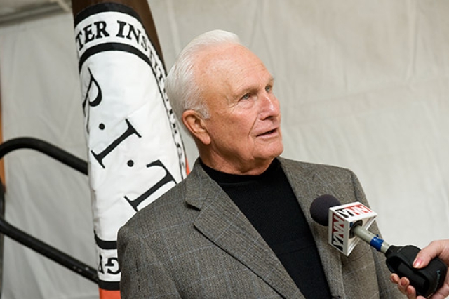 Professor giving speech at podium