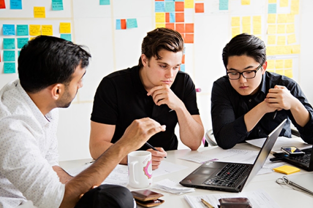 People working around table