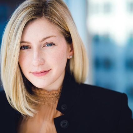 Head-and-shoulders view of woman wearing black blazer