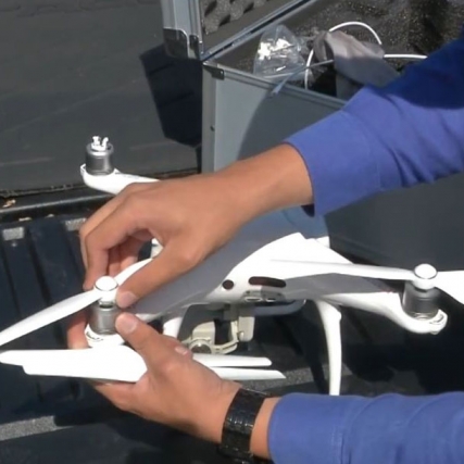 Student assembles drone.