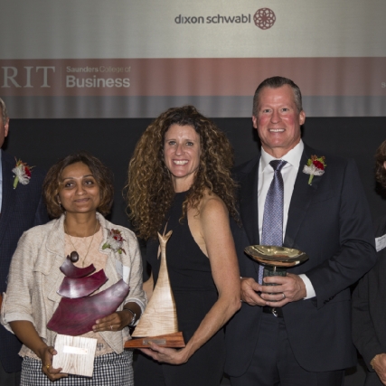 Frank Sklarsky, Dr. Shal Khazanchi, Carin DeMilo, and Scott Ingwers pose with their Recommence awards alongside Dean Jacqueline Mozrall.