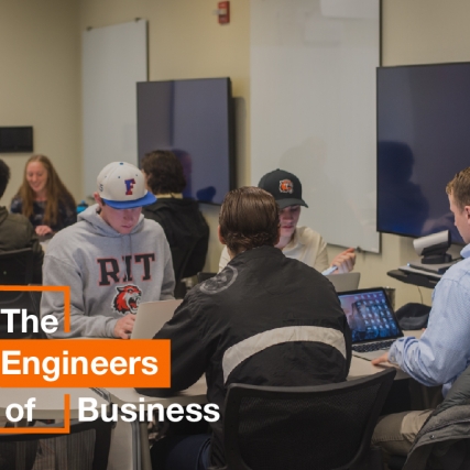 Four Saunders students study on their laptops.