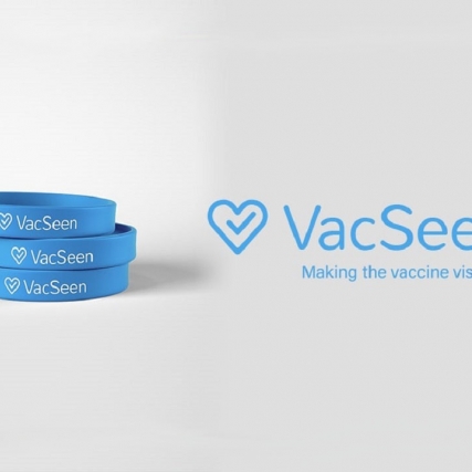 Three blue rubber bracelets with the writing "VacSeen." Logo for VacSeen Making the vaccine visible.