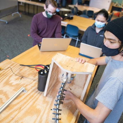 students working on robotic tail project.