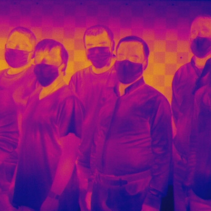 a thermal imaging photo of a team of researchers.