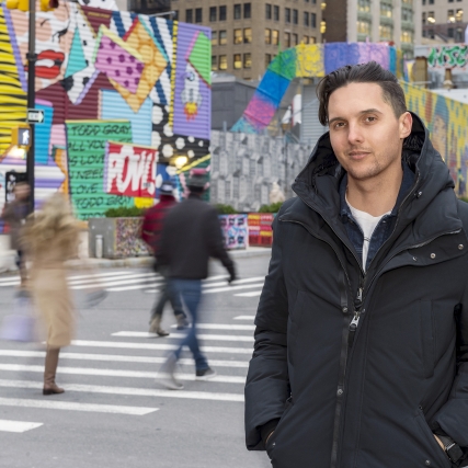 John Traver poses for a portrait outside in New York City.