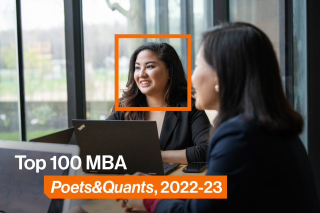 Two students sitting at a conference table