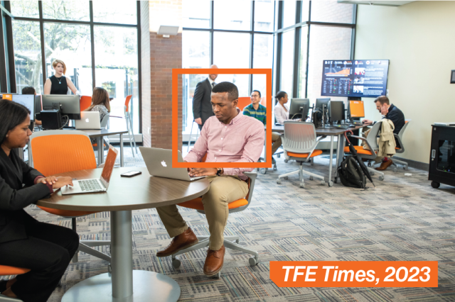 Students working on their laptops in a study space