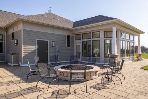 an outdoor firepit area inside the Lobozzo Alumni House