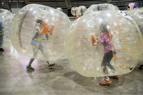 kids in bubble suits bumping into each other
