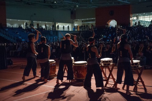 a concert with people playing large drums