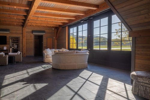seating area with sunshine and windows in the lodge