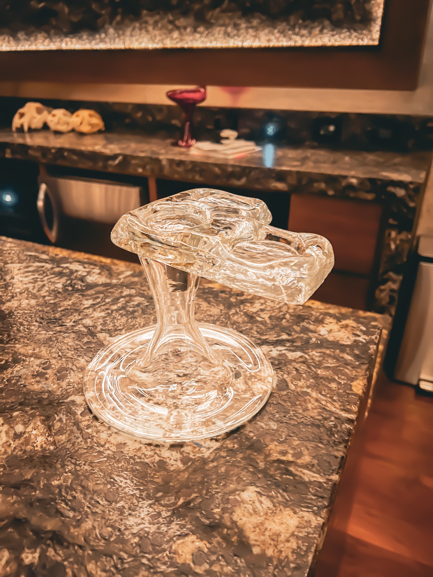 Clear glass version of Corner Enhancer with an elevated dish.