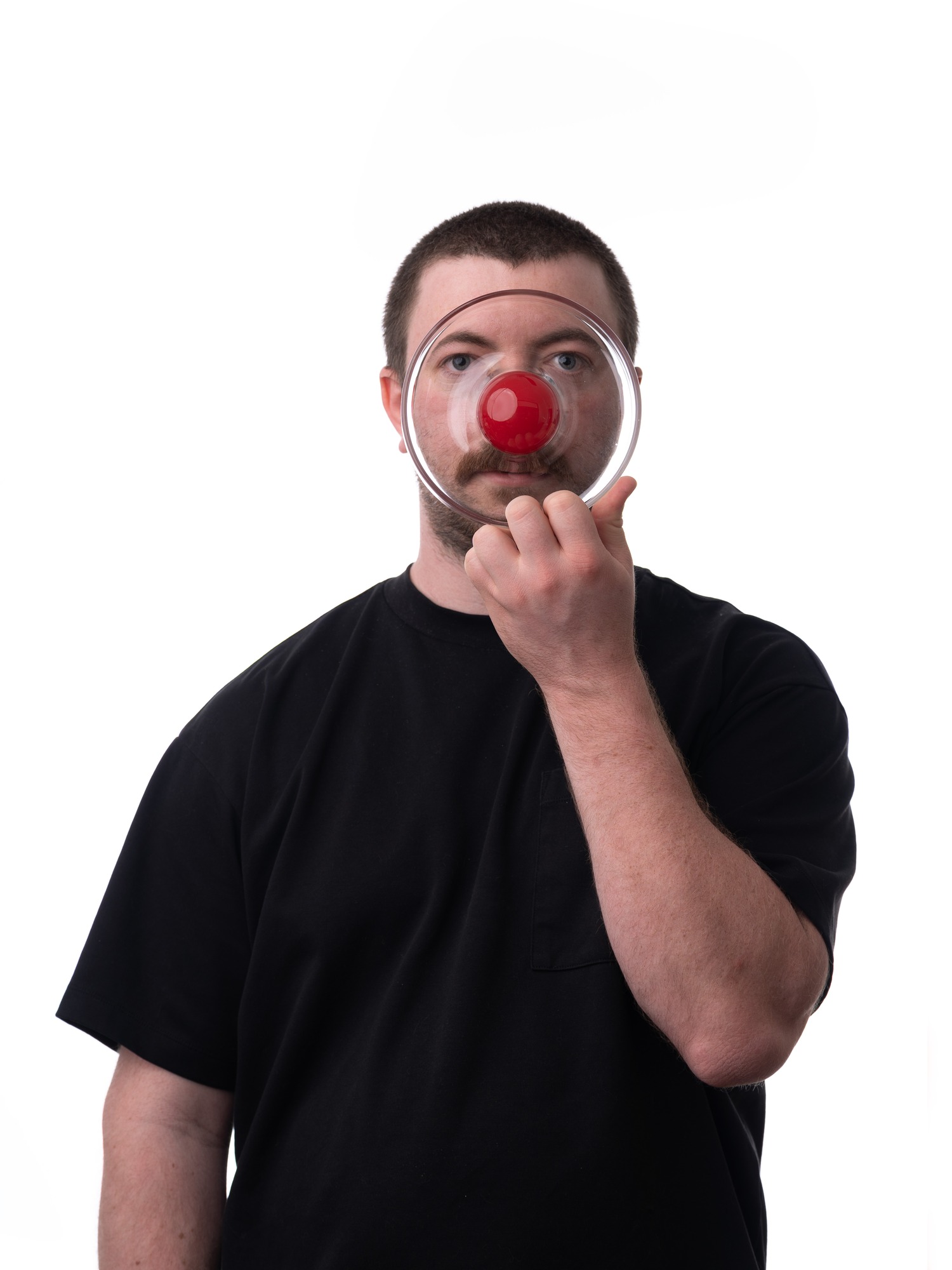 A person holding Rowl Bowl in front of their face.
