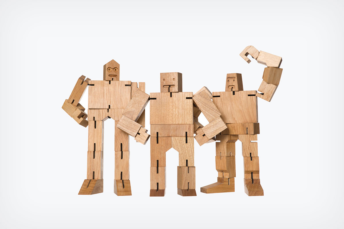 3 humanoid figures made out of blocks