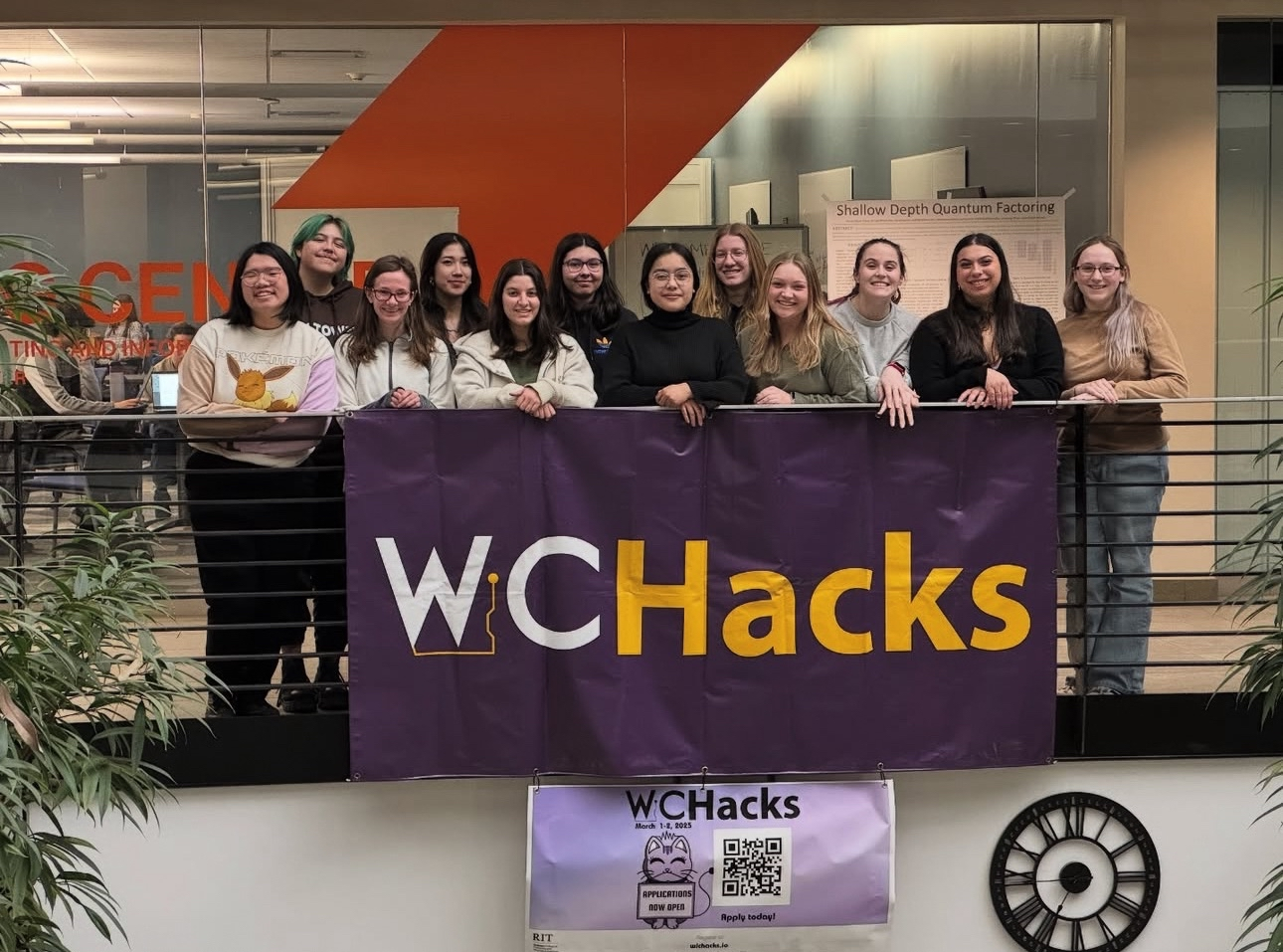 wichacks members behind the banner in the golisano atrium