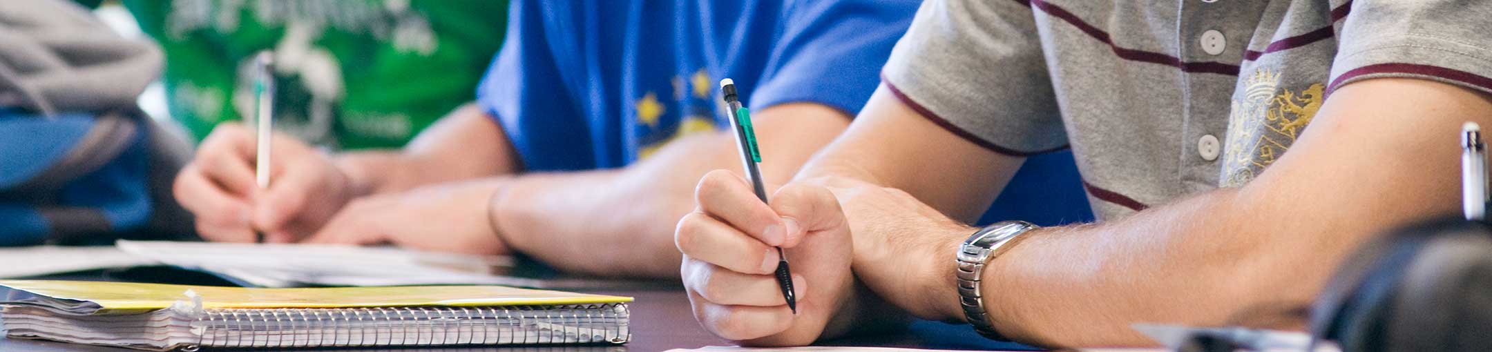 Students writing in a lab