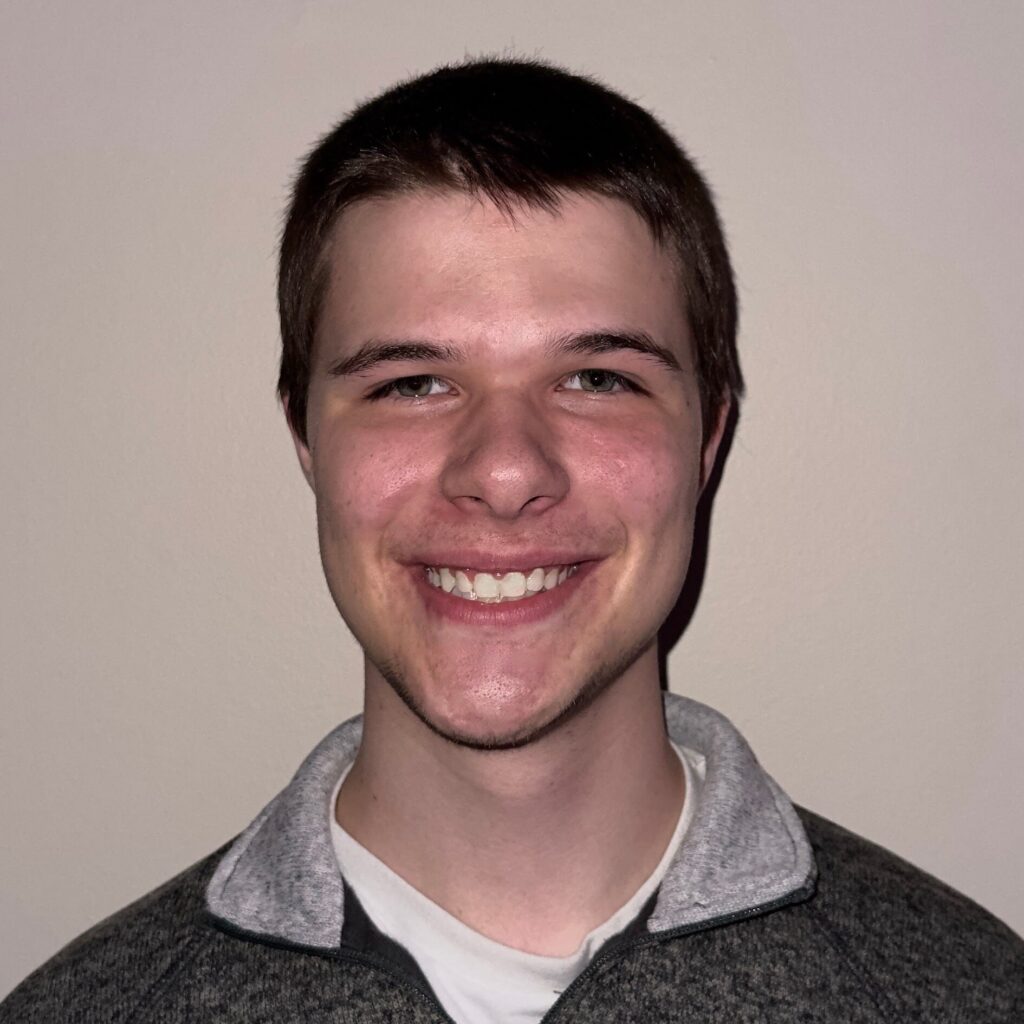 Head-and-shoulders portrait of the student recipient of the COS Emerson Summer Undergraduate Research Fellowship against a plain indoor background.