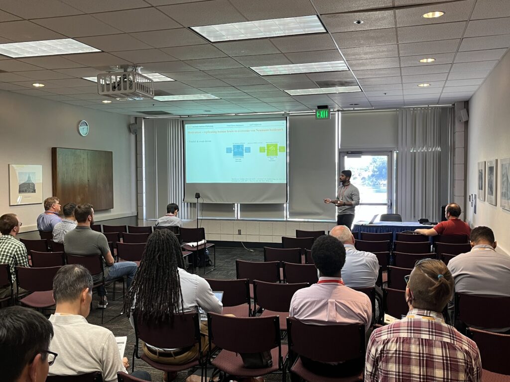 Nithil presenting in a conference room at the Electronic Materials Conference.