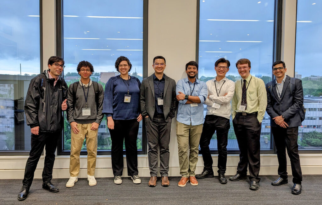 Xu Group members standing together at the 2024 Graphene and Beyond workshop.
