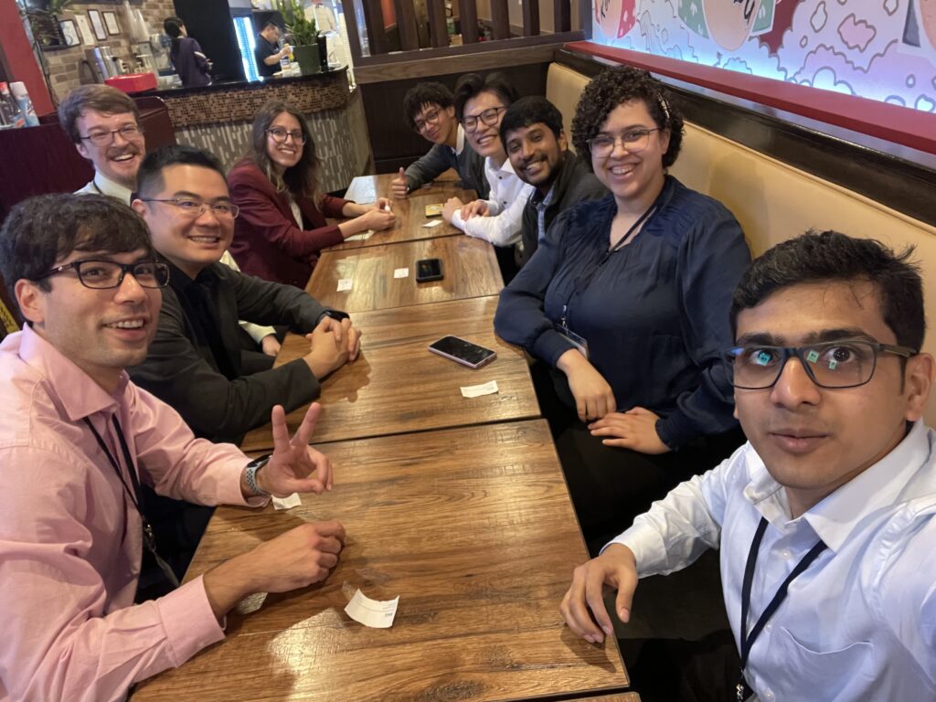 Xu Group members and collaborators seated together at dinner.
