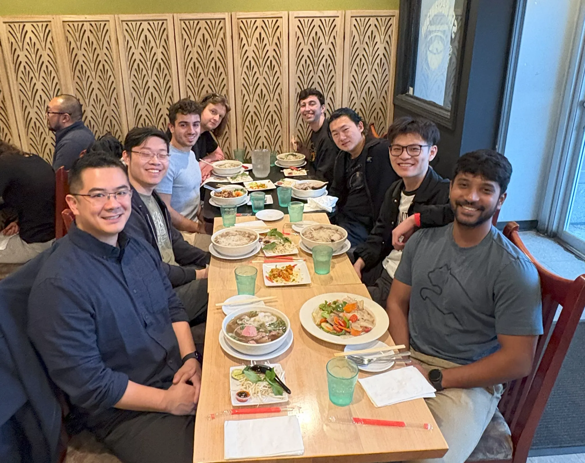 Xu Group members seated together at a restaurant table after the Spring 2025 semester.